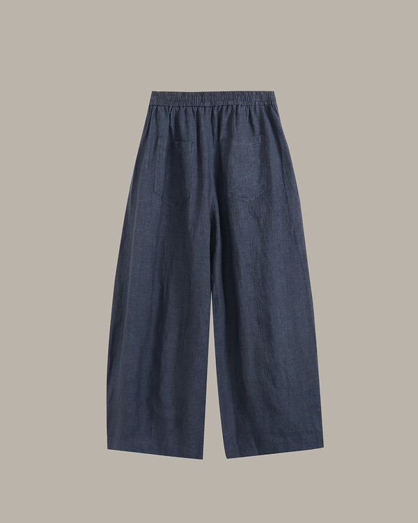 navy wide-leg pants on a light gray background
