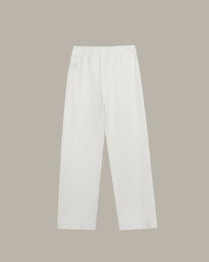 White pants on a beige background