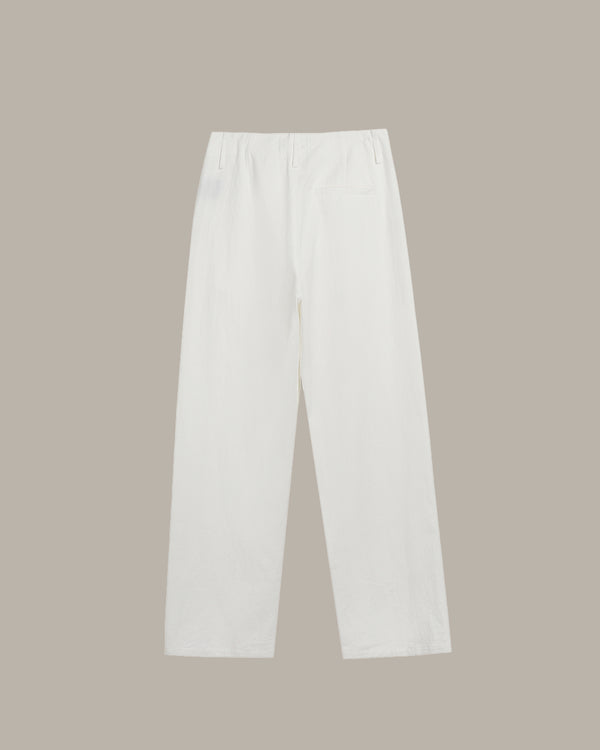 White pants on a beige background