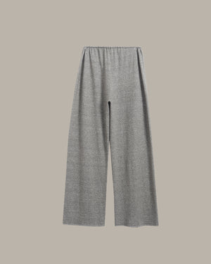 A pair of wide-leg knit pants in heather gray, shown flat against a solid taupe-gray background.