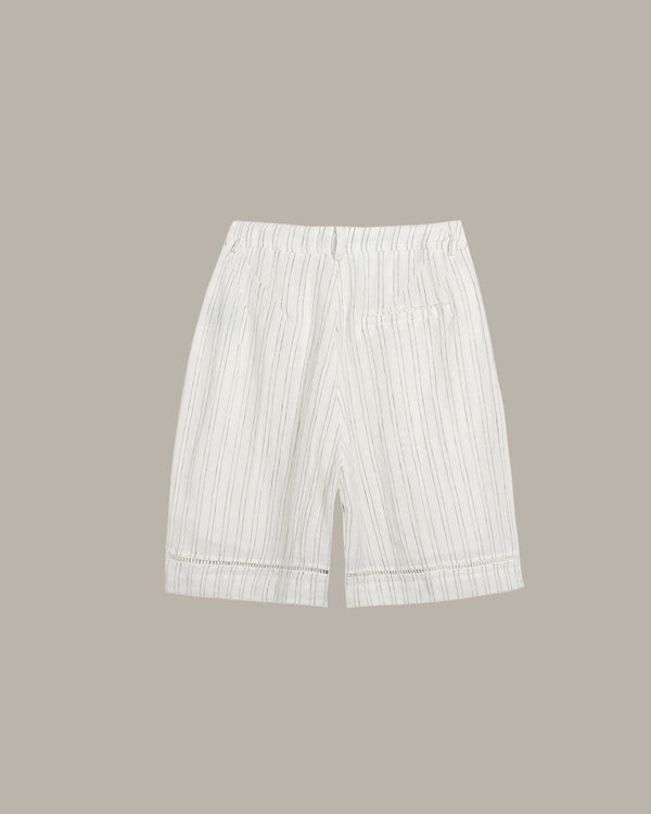 White striped shorts on a beige background