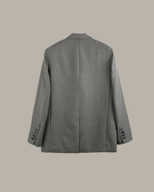 A gray textured blazer shown from the back, featuring a central seam, notched lapels, and button details on the cuffs, set against a solid beige background.