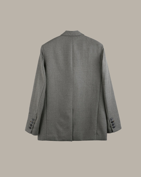 A gray textured blazer shown from the back, featuring a central seam, notched lapels, and button details on the cuffs, set against a solid beige background.