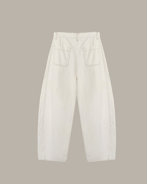 White jeans on a beige background