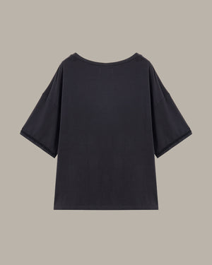 Black t-shirt on a beige background