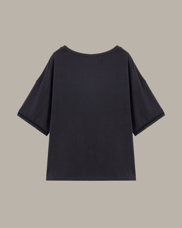 Black t-shirt on a beige background