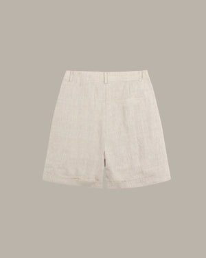 Light beige shorts on a gray background