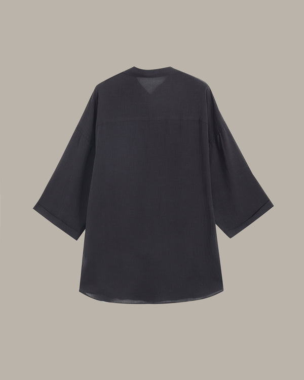 Black shirt on a beige background