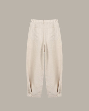 Beige pants on a gray background