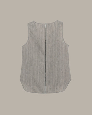 Sleeveless shirt with a zipper on a beige background