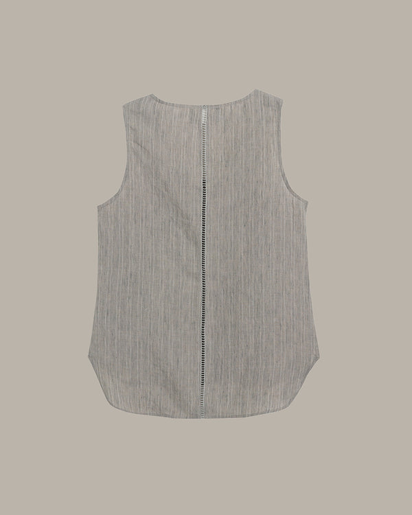 Sleeveless shirt with a zipper on a beige background