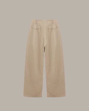 Beige pants on a light gray background