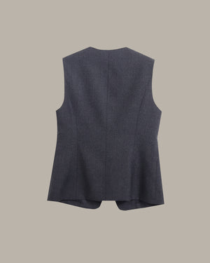 A sleeveless dark gray vest shown from the back, featuring a structured, slightly flared silhouette and a central seam, set against a solid beige background.