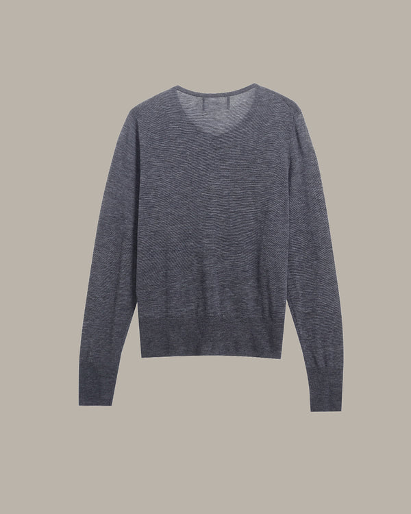 A dark gray heathered knit sweater with a wide crew neck and long sleeves, displayed flat against a solid taupe background.