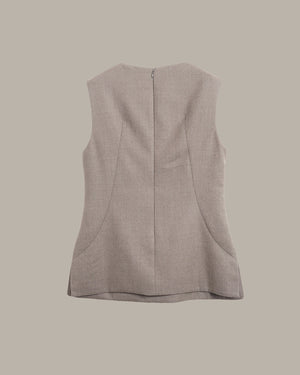 A sleeveless taupe-beige vest shown from the back, featuring a central seam and a zip closure, set against a solid taupe background.