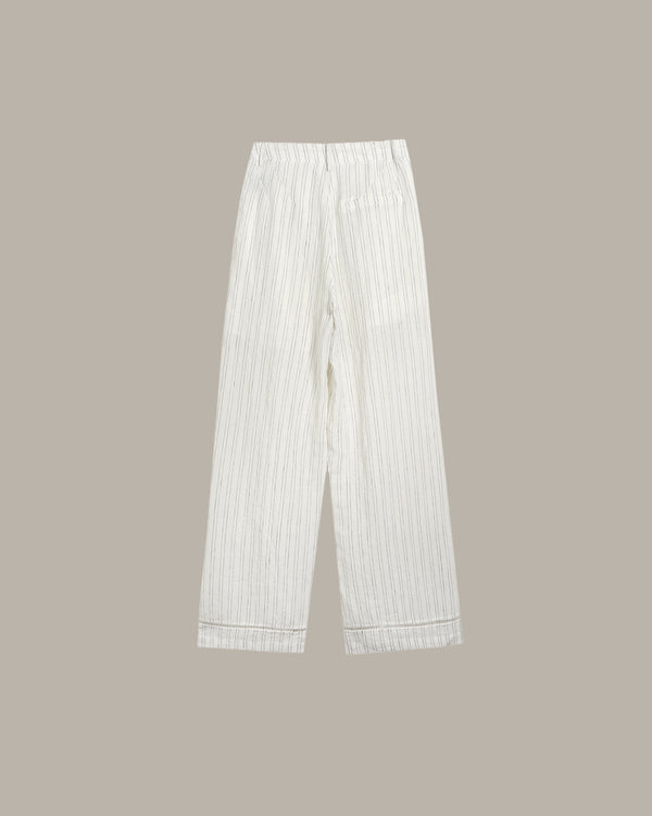 White striped pants on a beige background