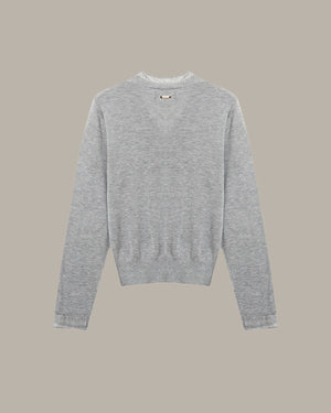 Gray sweater on a beige background