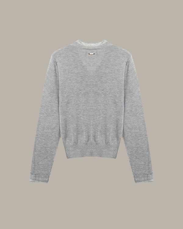 Gray sweater on a beige background