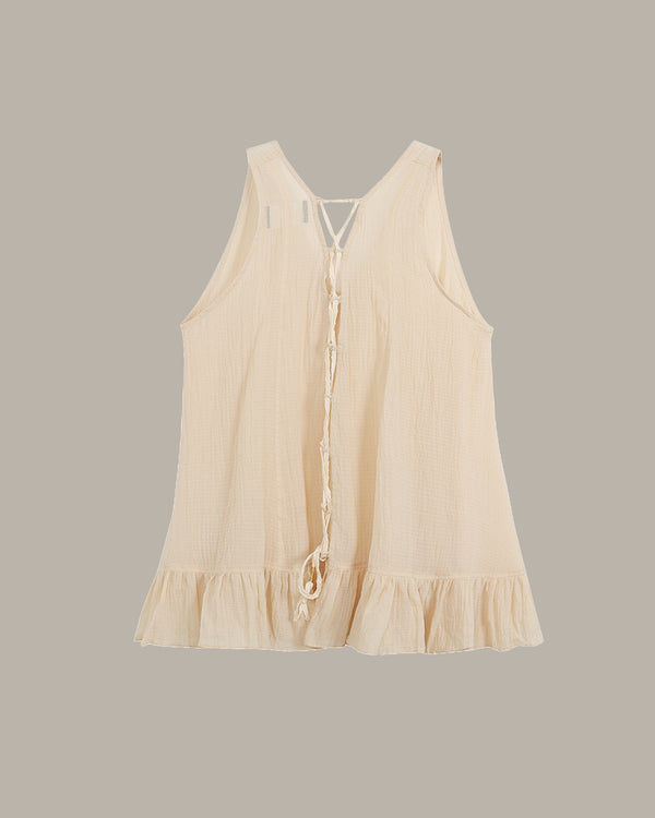Beige sleeveless top on a light gray background