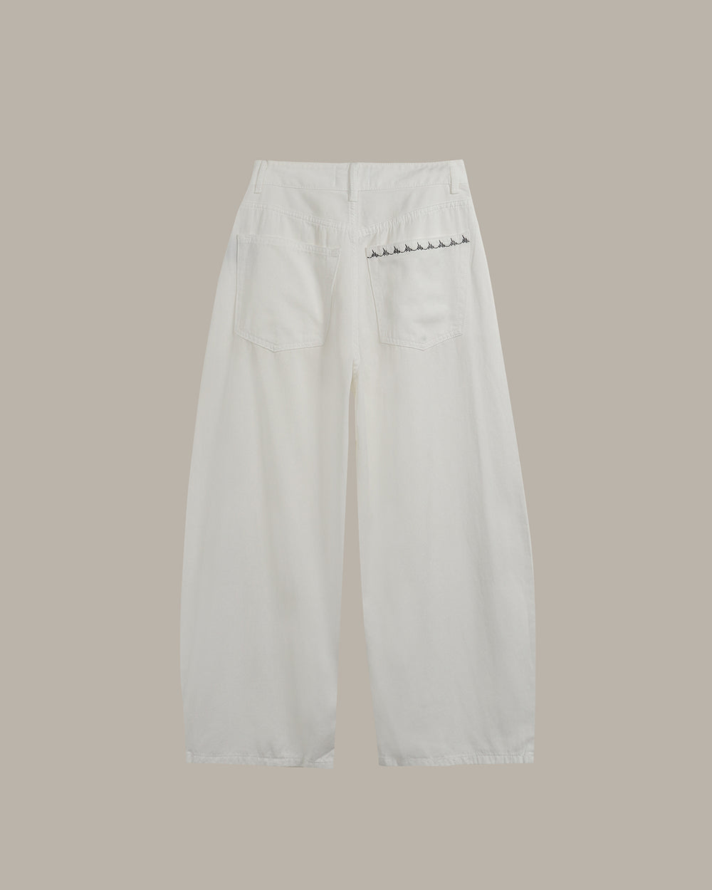 White wide-leg cropped pants with front pleats and belt loops, shown flat against a solid taupe background.