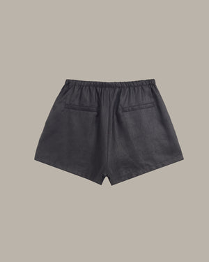 Dark gray shorts on a beige background