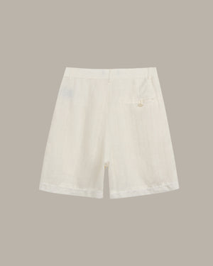 White denim skirt on a beige background