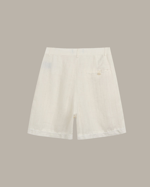White denim skirt on a beige background