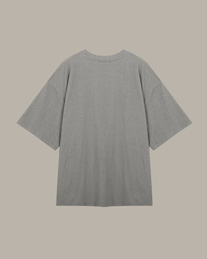 Gray t-shirt on a beige background