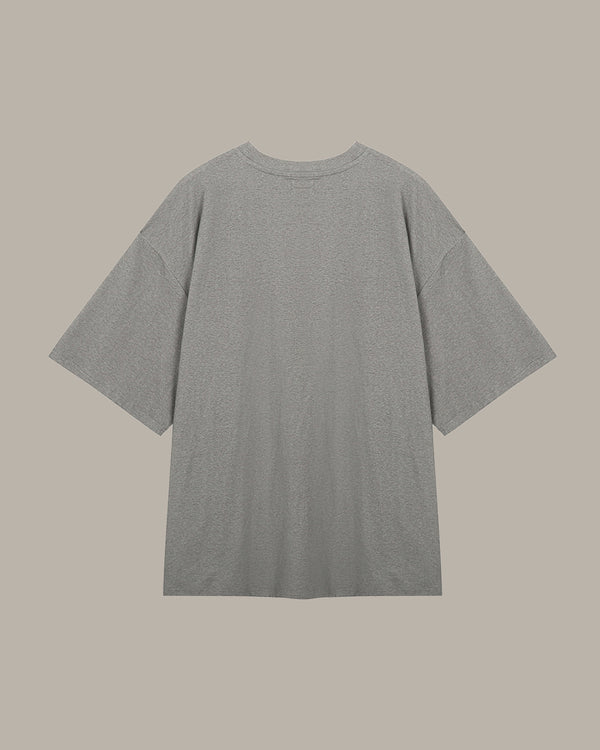 Gray t-shirt on a beige background
