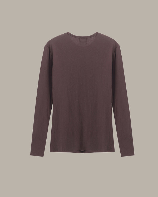 A long-sleeve crewneck t-shirt in a muted, dusty plum-brown color, displayed flat against a solid light gray background.