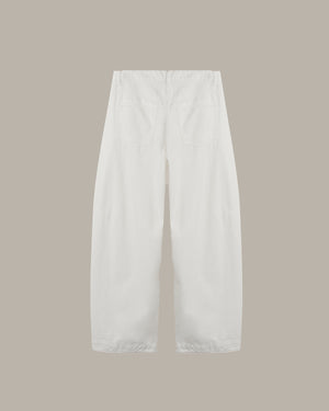 back of a White wide-leg cropped pants with a relaxed straight silhouette, shown from the back against a solid taupe background.