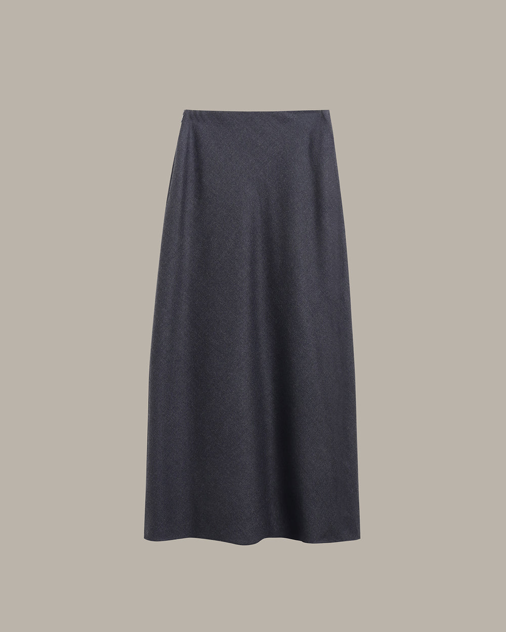 A dark charcoal gray knit midi skirt with a subtle textured pattern, shown flat against a solid taupe-gray background.