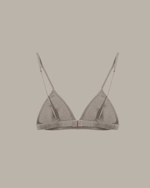 Gray bra on a beige background