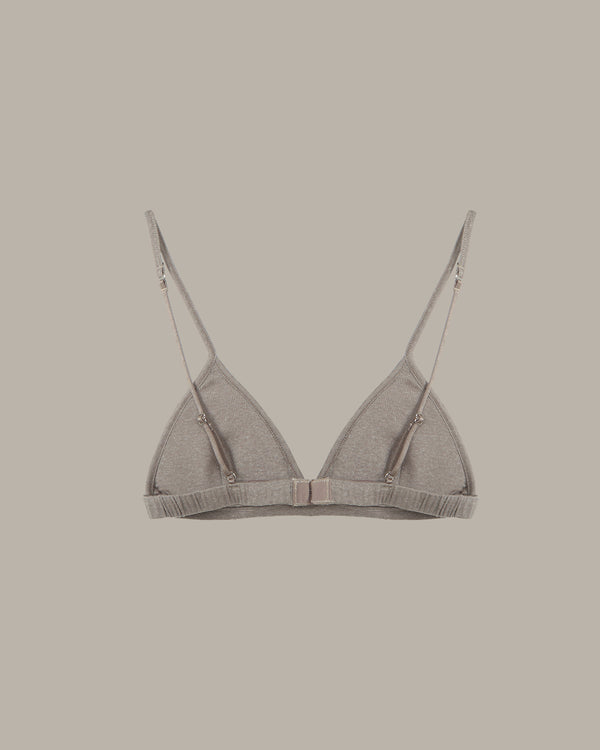 Gray bra on a beige background
