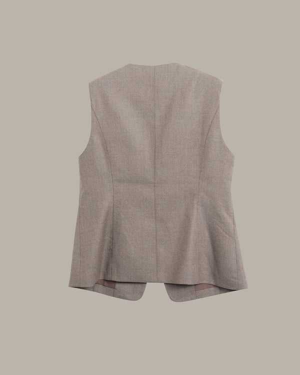 A sleeveless structured vest shown from the back, in a light taupe-beige fabric, against a solid neutral background.