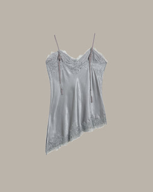 back of a gray lace-trimmed top on a beige background