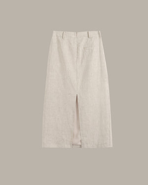 A pair of light beige linen wide-leg trousers with a front slit, shown flat against a solid taupe background.