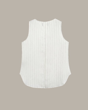 White sleeveless top with vertical stripes on a beige background
