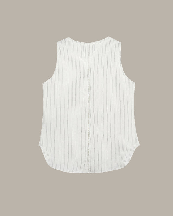 White sleeveless top with vertical stripes on a beige background