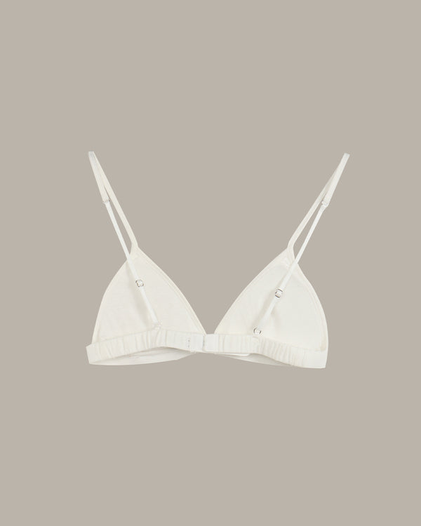 White bra on a beige background