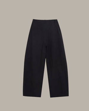Black pants on a beige background