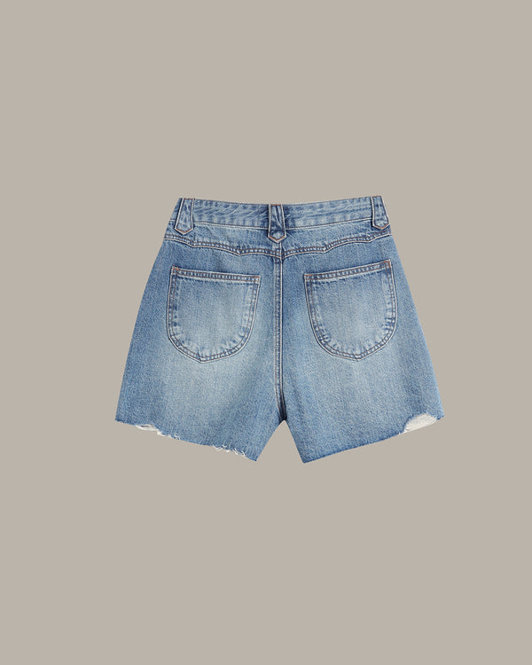 Light blue denim shorts with a high waist, frayed hem, and back pocket details, shown flat on a solid taupe background.