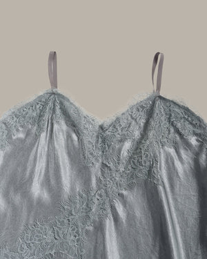 close up of Gray lace top on a beige background