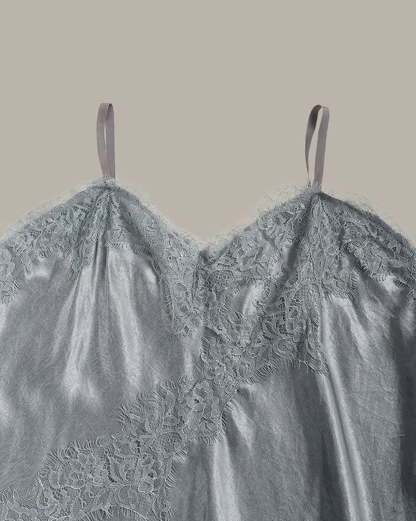 close up of Gray lace top on a beige background