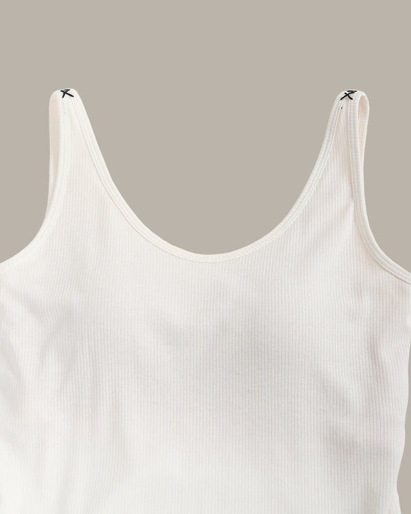 White tank top on a beige background