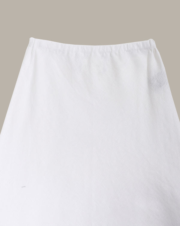 close up of a White skirt on a beige background