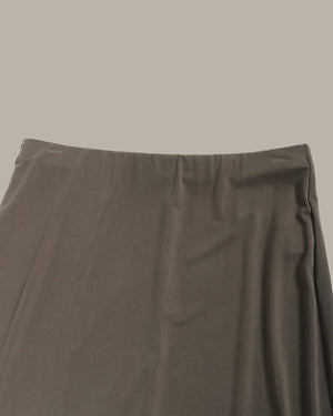 olive green skirt on a beige background