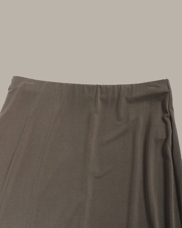 olive green skirt on a beige background