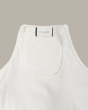 White tank top with 'CHLOECHEN' label on a beige background