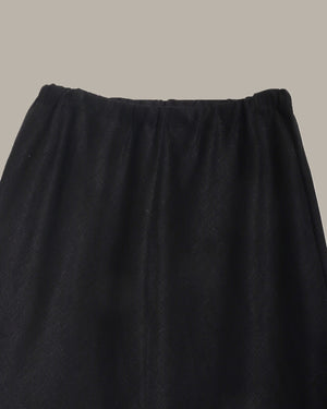 close up of a Black skirt on a neutral background